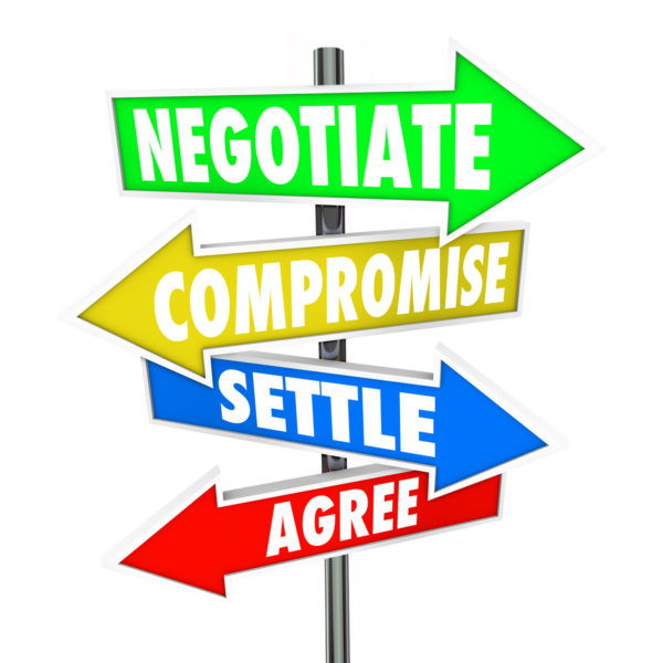 Negotiate, Compromise, Settle and Agree words on arrow signs to illustrate a diplomatic discussion to reach a mutually approved deal